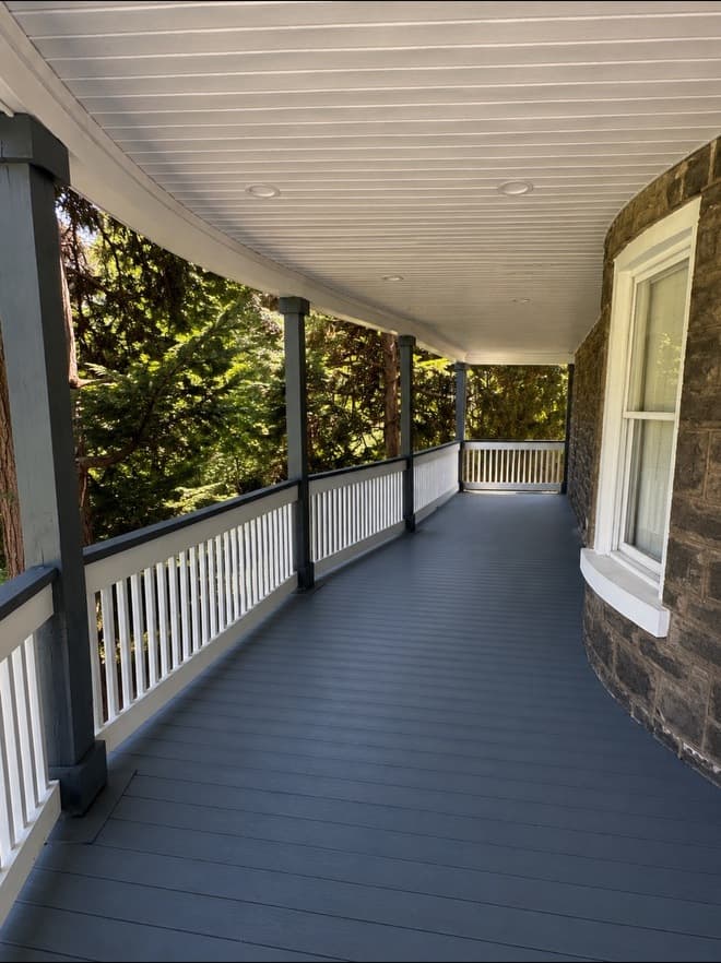 Side view of a curved porch and deck installation completed by The5thwall