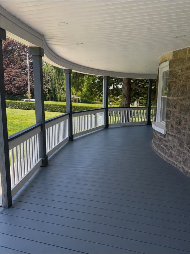 Full exterior view of a completed The5thwall porch and deck renovation