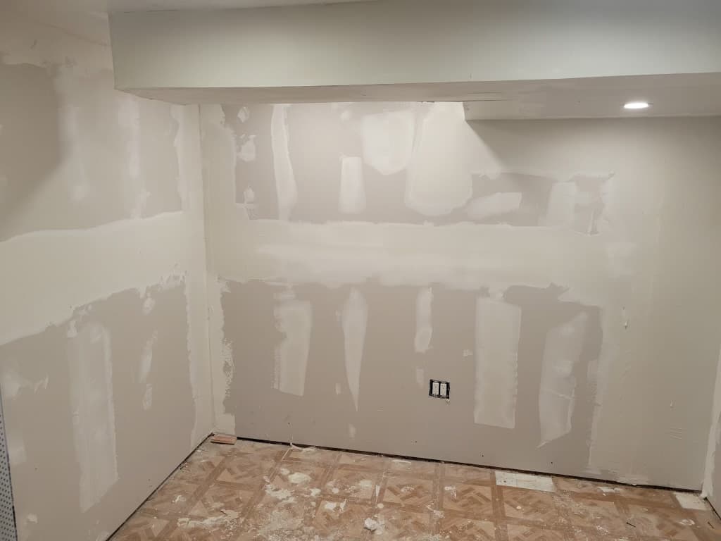 Residential basement — drywall tape and mud stage