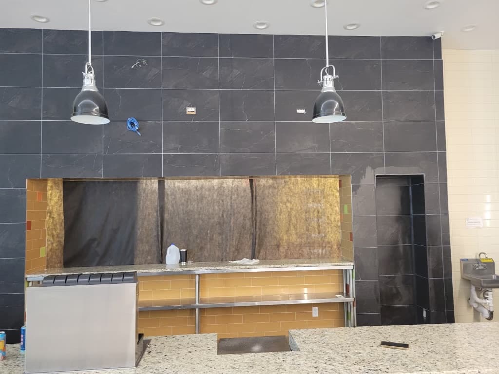 Meatheadz commercial kitchen — pendants hung, finish stage